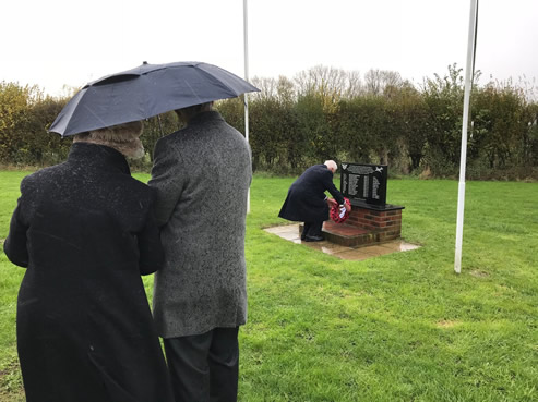 Michael places wreath